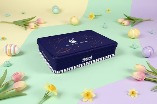 Navy blue tin box with checkered border on easter background.